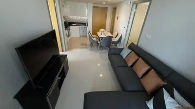 a living room with a couch and a table at Aykon city in Dubai