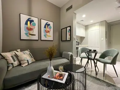 a living room with a couch and a table at KeyRock Living - 20th Floor Comfort at Zada in Dubai