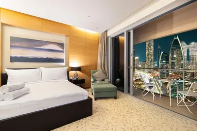 a bedroom with a bed and a view of a city at Burj Khalifa View & Mall Entry in 3 Mins & Sleeps 3 Adults in Dubai