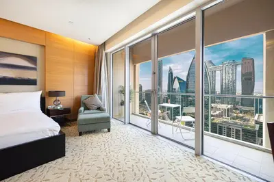 a bedroom with a bed and a large window at Burj Khalifa View & Mall Entry in 3 Mins & Sleeps 3 Adults in Dubai