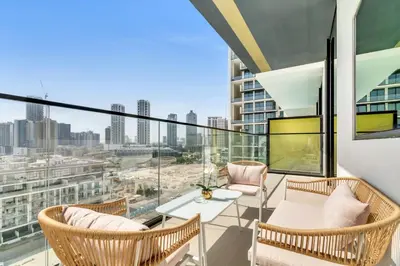 a balcony with a view of a city skyline at GuestReady - Jumeirah Village haven with pool view in Dubai