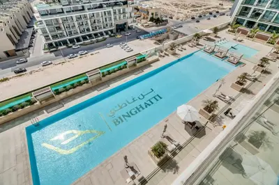 an overhead view of a swimming pool at a resort at GuestReady - Jumeirah Village haven with pool view in Dubai