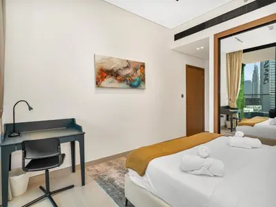a bedroom with a desk and a bed and a desk and a chair at Trendy 1BR Private Jacuzzi Burj Khalifa View in Dubai
