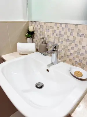 a bathroom sink with a faucet on top of it at Burj Khalifa Panoramic view-1BR,4 guests, Downtown in Dubai