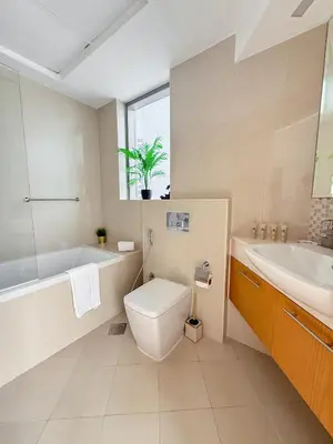 a bathroom with a tub and a toilet and a sink at Burj Khalifa Panoramic view-1BR,4 guests, Downtown in Dubai