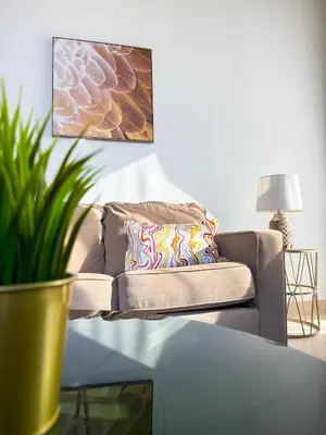 a living room with a couch and a table at Burj Khalifa Panoramic view-1BR,4 guests, Downtown in Dubai