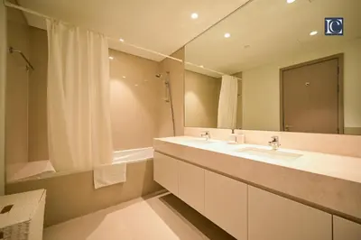 a bathroom with two sinks and a large mirror at Stylish Downtown Dubai Stay Act 1 Act 2 Tower 1 in Dubai