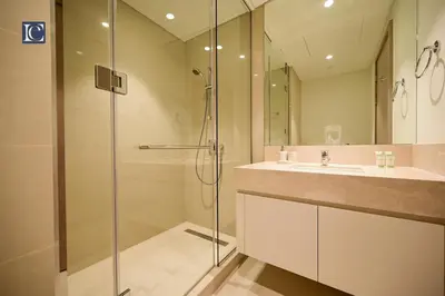 a bathroom with a shower and a sink at Stylish Downtown Dubai Stay Act 1 Act 2 Tower 1 in Dubai
