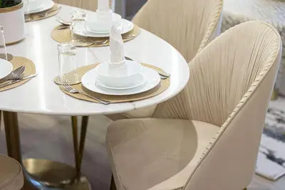 a white table with chairs and plates on it at Gogoto3 High Floor Burj Khalifa NYE Fireworks View PS5 in Dubai