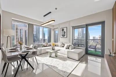a living room with a couch and a table at 29 Boulevard - Luxury 2BR Apartment with Burj Khalifa & Fountain View in Dubai