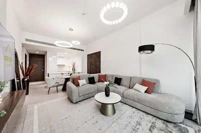 a living room with a couch and a table at Luxury 2BR Apartment Burj Khalifa View in Al Safa in Dubai