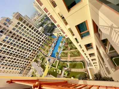 a view from the balcony of a hotel with buildings at Luxury Spacious 2BR in Palm Jumeirah in Dubai