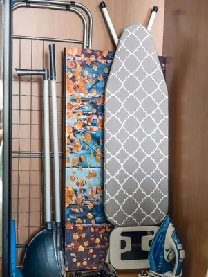 a snowboard is hanging on a rack at Modern Studio Private Jacuzzi Canal View in Dubai