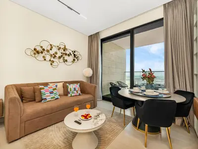 a living room with a couch and a table at Modern Studio Private Jacuzzi Canal View in Dubai