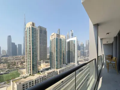 a balcony with a view of a city skyline at Contemporary Urban 2BR Apartment in Dubai
