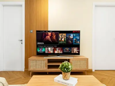 a living room with a large flat screen tv at Stunning Newly Furnished Elegant LUX Apartment in Dubai