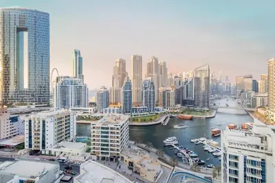 a view of a city with a river and buildings at Stunning Newly Furnished Elegant LUX Apartment in Dubai