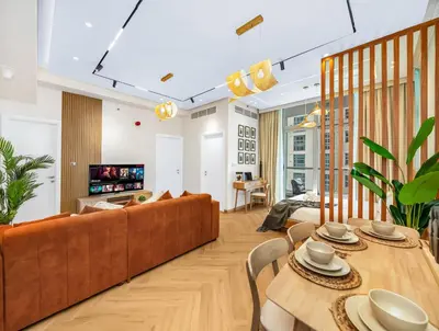 a living room with a couch and a table at Stunning Newly Furnished Elegant LUX Apartment in Dubai