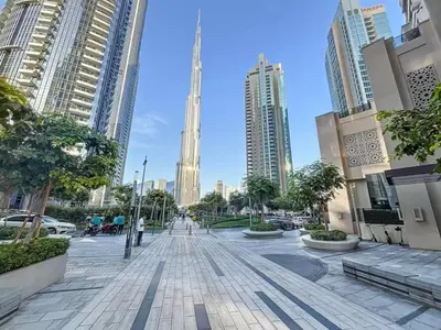 a city street in a city with tall buildings at Vogue Downtown Act One near Burj Khalifa and Dubai Mall, Two Bedroom Apartment with Balcony and City Skyline View, Access to All Amenities in Dubai