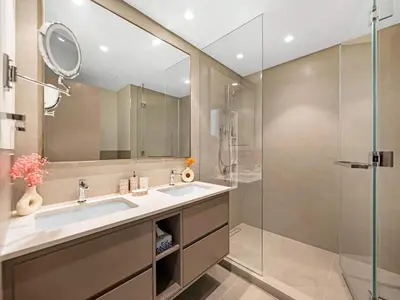 a bathroom with a sink and a shower at Grande Signature Residence 907 Full Burj Khalifa and Dubai Dancing Fountain View 5 Min Walk Dubai Mall Luxury Downtown Apartment in Dubai