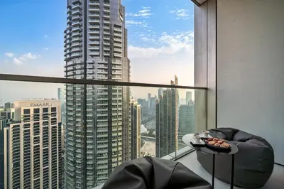 a room with a view of a tall building at Elegant 2BR Apartment near Burj Khalifa, Downtown Dubai in Dubai