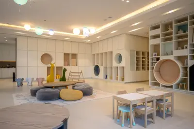 a room with tables and chairs in a room at Elegant 2BR Apartment near Burj Khalifa, Downtown Dubai in Dubai