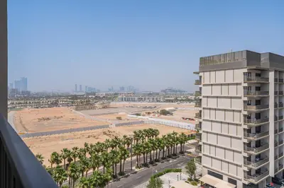 an aerial view of a city with palm trees and a building at PVH - Serene Studio minutes to Downtown - MAG Eye in Dubai