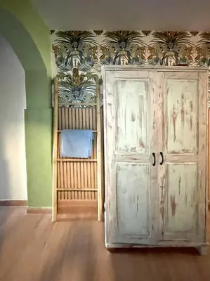 a room with a door and a bunk bed at Palm Oasis Guest House in Dubai