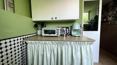a kitchen with a counter with a microwave on it at Palm Oasis Guest House in Dubai
