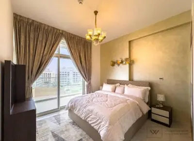 a bedroom with a bed and a large window at Huge luxurious 1 bedroom in Dubai