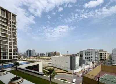 a view of a city with buildings and palm trees at Huge luxurious 1 bedroom in Dubai