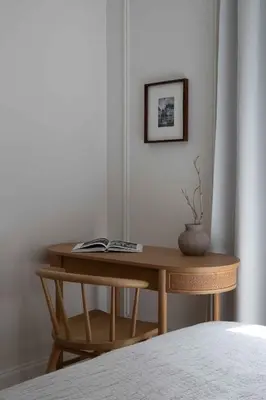 a wooden table in a room with a picture on the wall at Waterfront View, Boutique apartment, Lagoon Access in Dubai