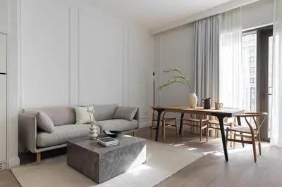 a living room with a couch and a table at Waterfront View, Boutique apartment, Lagoon Access in Dubai