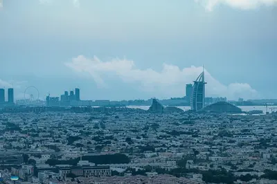 an aerial view of a city with skyscrapers at Cozy Sunset Retreat - Burj, Palm & Sea View - 2 BR in Dubai