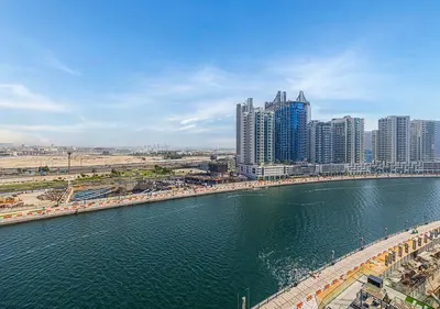 a city with tall buildings and a body of water at Livin' Holidays - Studio - Canal view with jacuzzi in Dubai