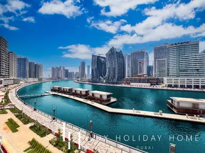 a view of a river in a city with tall buildings at LUX The Northside Studio in Dubai