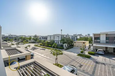 an aerial view of a parking lot in a city at Bookable - 4 Bedroom Elan 1 Tilal Al Ghaf Villa in Dubai