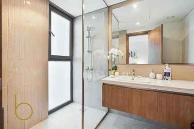 a bathroom with a shower and a sink at Bookable - 4 Bedroom Elan 1 Tilal Al Ghaf Villa in Dubai