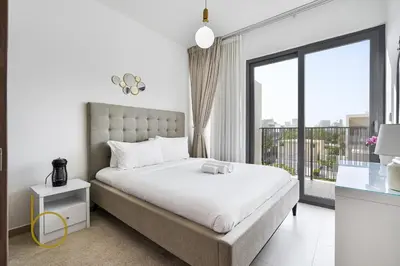 a bedroom with a bed and a large window at Bookable - 4 Bedroom Elan 1 Tilal Al Ghaf Villa in Dubai