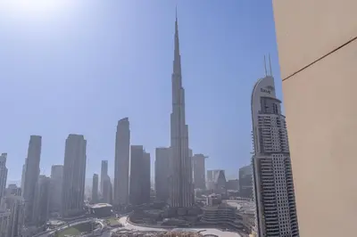 a view of a city from the top of a skyscraper at Luxury 3BR, MaidRoom Full Burj & Fountain Views in Dubai