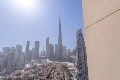 a view of a city from a skyscraper at Luxury 3BR, MaidRoom Full Burj & Fountain Views in Dubai
