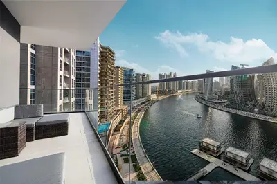 a view of a river in a city with buildings at Luxury 2BR with Canal View Burj Khalifa view and Infinity Pool Access in Dubai