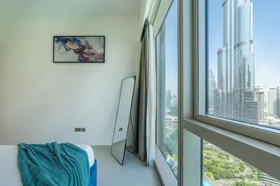 a room with a large window with a view of a city at Stunning Burj Khalifa & Fountain Views in Dubai
