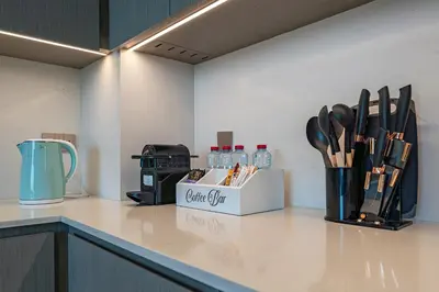 a kitchen counter with a box of utensils on it at Stunning Burj Khalifa & Fountain Views in Dubai