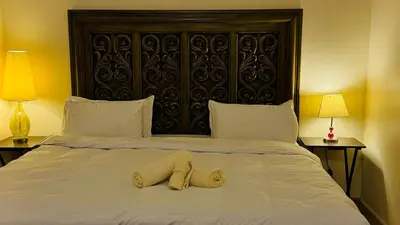 a bed with two towels on top of it at Marina View Luxury Retreat Modern Apartment JBR Dubai in Dubai