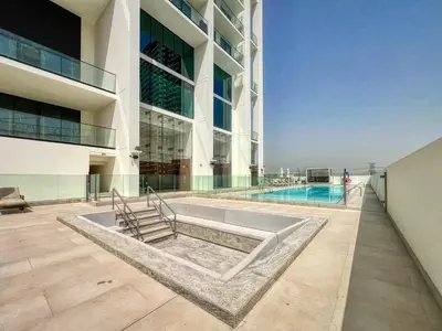 a view of a building with a swimming pool at GuestReady - Stunning unit at Binghatti House in Dubai