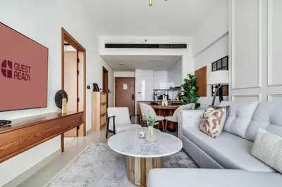 a living room with a couch and a table at GuestReady - Stunning unit at Binghatti House in Dubai
