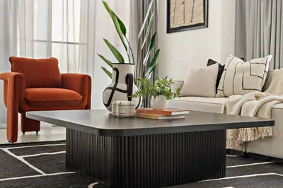 a living room with a coffee table and a couch at Silkhaus Elite 1BDR in Canal Front Tower in Dubai