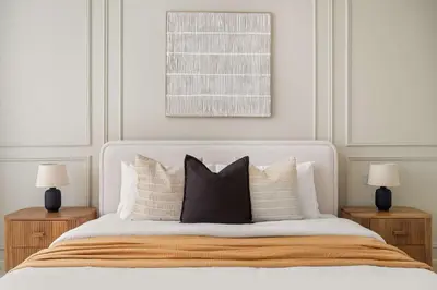 a bedroom with a white bed with two night stands at Silkhaus Elegant 1BDR in Sky gardens with Metro Access in Dubai