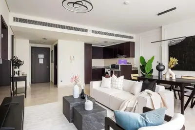 a living room with a white couch and a table at Silkhaus Elegant 1BDR in Sky gardens with Metro Access in Dubai
